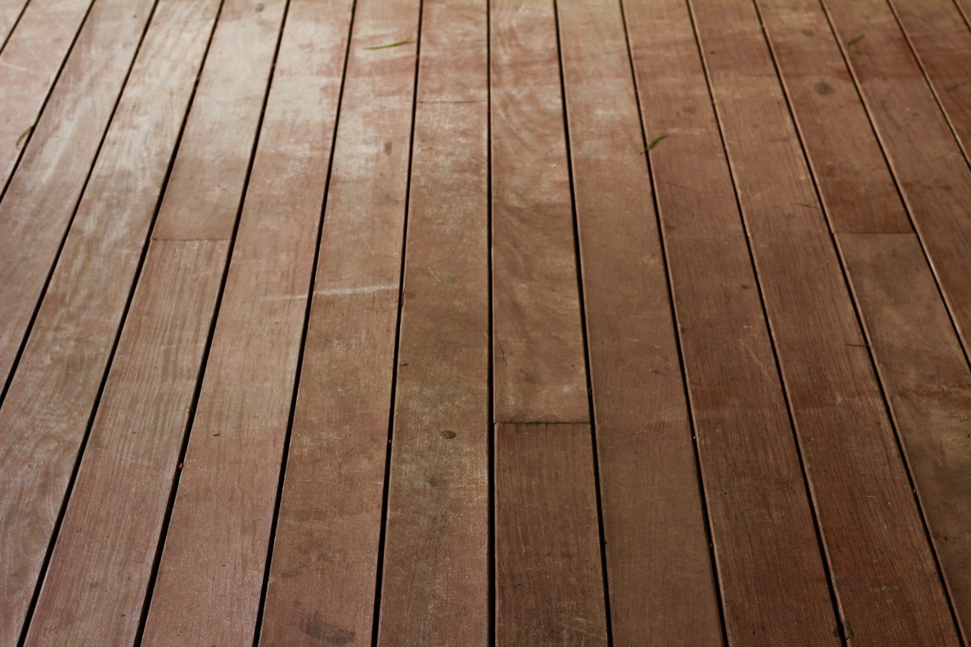 Low-angle view of rich brown hardwood floor planks